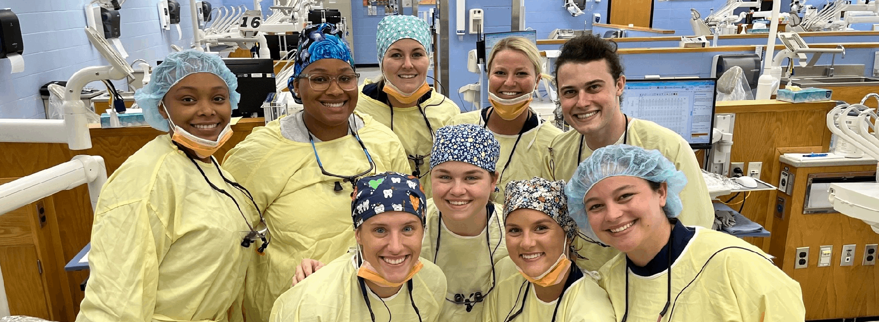 Group of smiling dental hygiene students in the lab